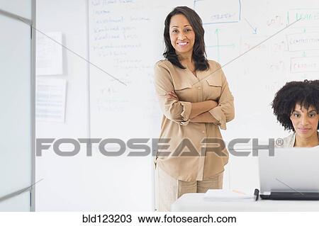 Stock Image - African American businesswomen in office. Fotosearch
