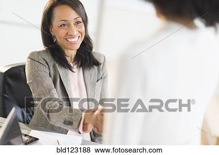 African American businesswomen shaking hands View Large Photo Image Stock Photo - African American businesswomen shaking hands. Fotosearch