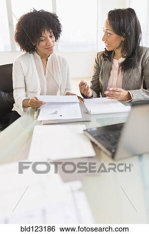 African American businesswomen talking in meeting View Large Photo Image Stock Photograph - African American businesswomen talking in meeting. Fotosearch