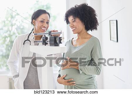 African American doctor weighing pregnant woman View Large Photo Image Stock Image - African American doctor weighing pregnant woman. Fotosearch