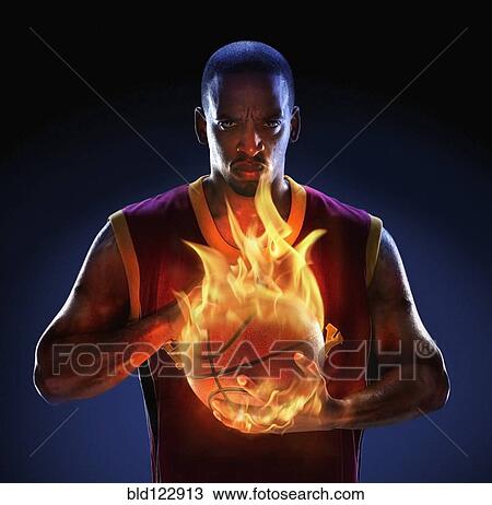 African American man holding flaming basketball View Large Photo Image Stock Image - African American man holding flaming basketball. Fotosearch
