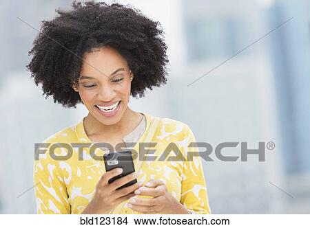 African American using cell phone View Large Photo Image Picture - African American using cell phone. Fotosearch