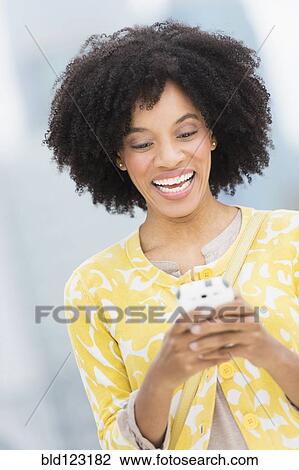African American using cell phone View Large Photo Image Stock Image - African American using cell phone. Fotosearch