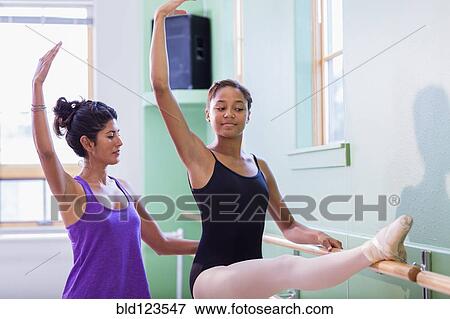 Ballerina practicing with teacher View Large Photo Image Stock Photo - Ballerina practicing with teacher. Fotosearch
