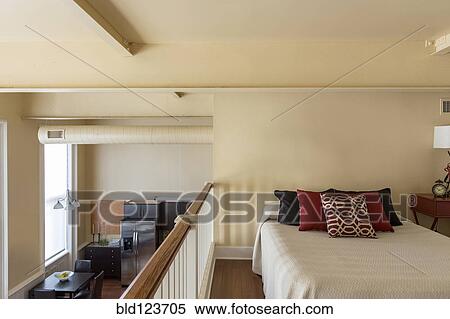 Bed in loft of modern home View Large Photo Image Stock Photography - Bed in loft of modern home. Fotosearch