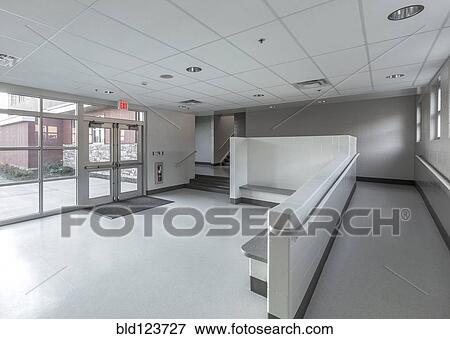 Stock Photo - Benches, ramp and stairs in lobby of animal shelter. Fotosearch