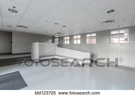 Stock Photography - Benches, ramp and stairs in lobby of animal shelter. Fotosearch