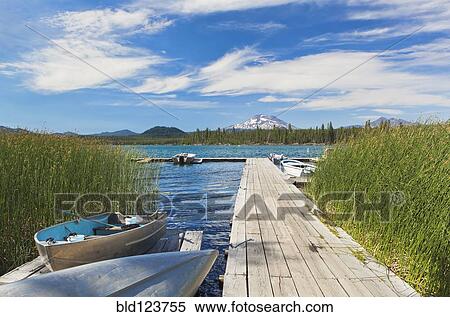 Boat moored along pier, Davis Lake, Bend, Oregon, United States View Large Photo Image Stock Photography - Boat moored along pier, Davis Lake, Bend, Oregon, United States. Fotosearch