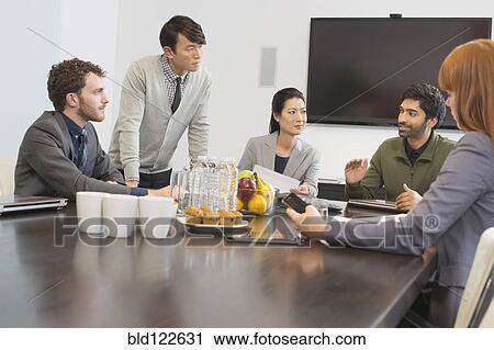 Business people talking in meeting View Large Photo Image Stock Image - Business people talking in meeting. Fotosearch