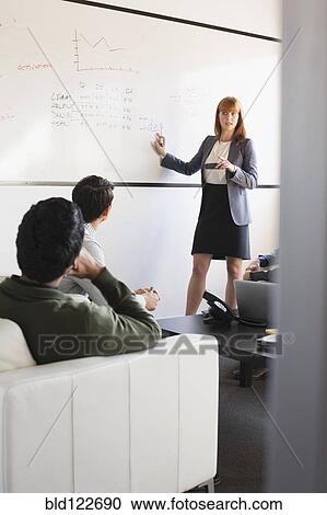 Business people talking in meeting View Large Photo Image Stock Image - Business people talking in meeting. Fotosearch