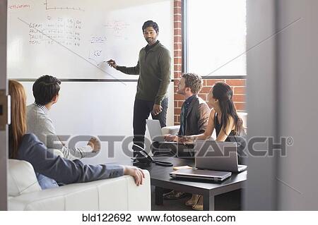 Business people talking in meeting View Large Photo Image Stock Image - Business people talking in meeting. Fotosearch