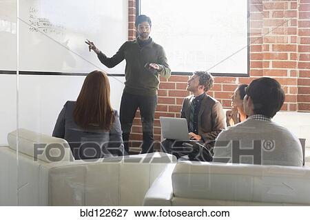 Stock Photo - Business people talking in meeting. Fotosearch
