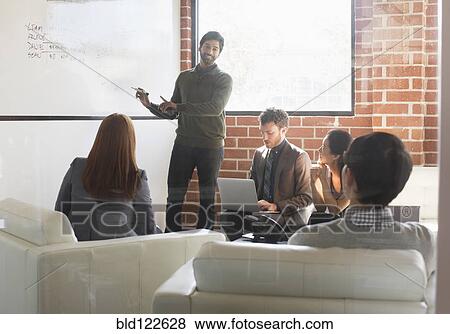 Business people talking in meeting View Large Photo Image Stock Photo - Business people talking in meeting. Fotosearch