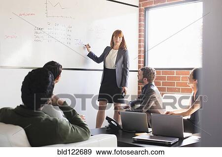 Business people talking in meeting View Large Photo Image Stock Photo - Business people talking in meeting. Fotosearch