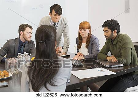 Business people talking in meeting View Large Photo Image Stock Photograph - Business people talking in meeting. Fotosearch
