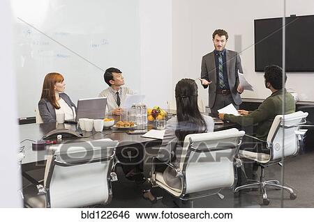 Business people talking in meeting View Large Photo Image Stock Photograph - Business people talking in meeting. Fotosearch