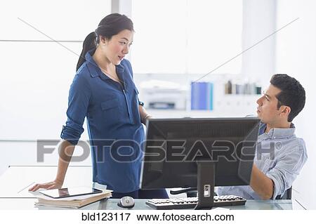 Business people talking in office View Large Photo Image Stock Photo - Business people talking in office. Fotosearch
