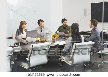 Stock Photo - Business people working in office. Fotosearch