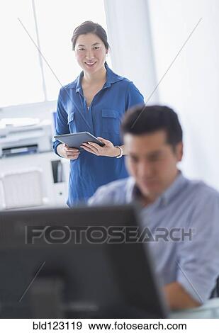 Business people working in office View Large Photo Image Stock Photo - Business people working in office. Fotosearch
