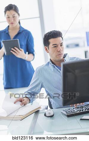 Business people working in office View Large Photo Image Stock Photograph - Business people working in office. Fotosearch
