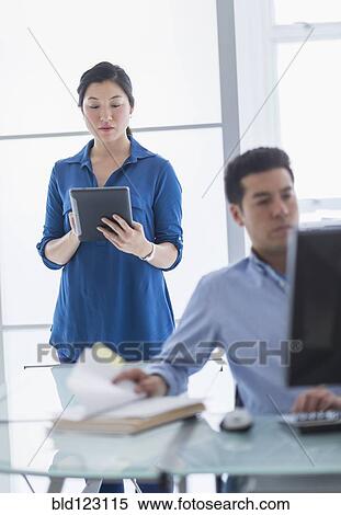Stock Photography - Business people working in office. Fotosearch