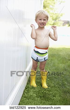 Caucasian boy wearing diaper and rain boots outdoors View Large Photo Image Stock Photography - Caucasian boy wearing diaper and rain boots outdoors. Fotosearch