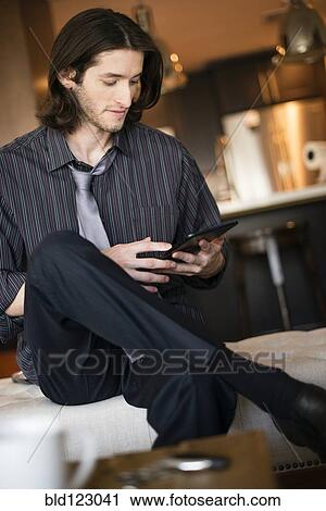 Caucasian businessman using digital tablet View Large Photo Image Stock Image - Caucasian businessman using digital tablet. Fotosearch
