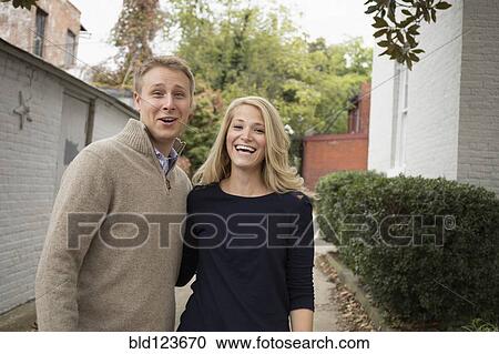 Caucasian couple hugging outdoors View Large Photo Image Stock Image - Caucasian couple hugging outdoors. Fotosearch