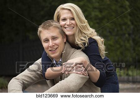 Caucasian couple hugging outdoors View Large Photo Image Stock Photo - Caucasian couple hugging outdoors. Fotosearch