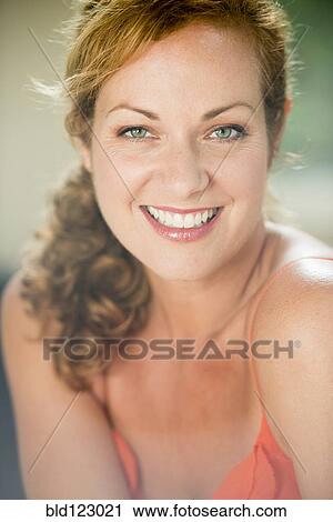 Caucasian woman smiling outdoors View Large Photo Image Stock Image - Caucasian woman smiling outdoors. Fotosearch