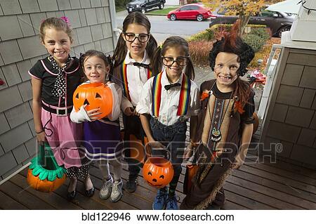 Children trick-or-treating for Halloween View Large Photo Image Stock Photograph - Children trick-or-treating for Halloween. Fotosearch