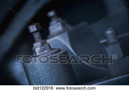 Close up of nuts and bolts on machinery View Large Photo Image Stock Photograph - Close up of nuts and bolts on machinery. Fotosearch