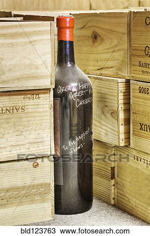 Close up of signed wine bottle in cellar View Large Photo Image Stock Image - Close up of signed wine bottle in cellar. Fotosearch
