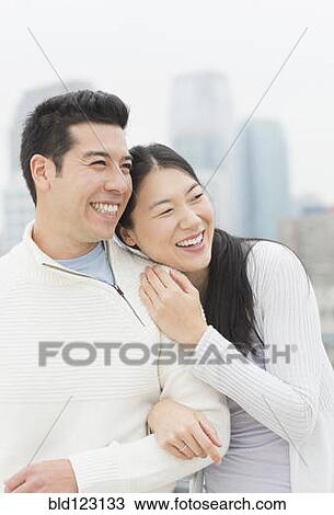 Couple hugging in city View Large Photo Image Stock Image - Couple hugging in city. Fotosearch