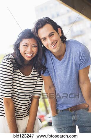 Couple leaning and smiling View Large Photo Image Stock Photo - Couple leaning and smiling. Fotosearch