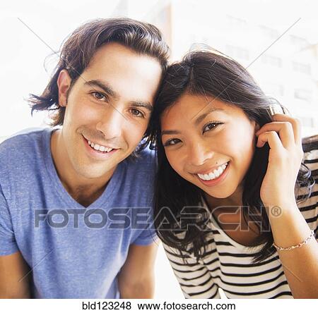 Stock Photo - Couple smiling together outdoors. Fotosearch