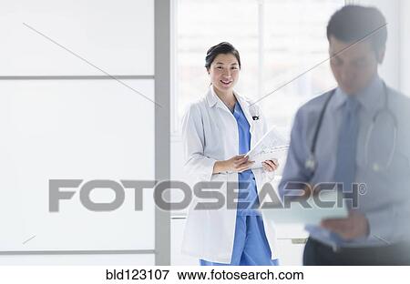 Stock Photo - Doctors working in hospital. Fotosearch