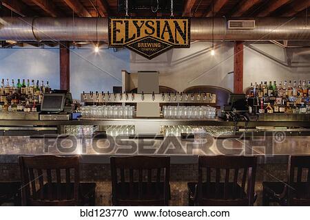 Stock Image - Elysian Brewing sign over bar, Seattle, Washington, United States. Fotosearch