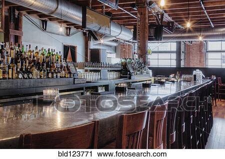 Stock Image - Empty stools at bar. Fotosearch
