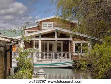 Houseboat on canal View Large Photo Image Stock Photo - Houseboat on canal. Fotosearch