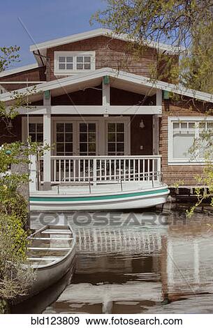 Houseboat on canal View Large Photo Image Stock Photo - Houseboat on canal. Fotosearch