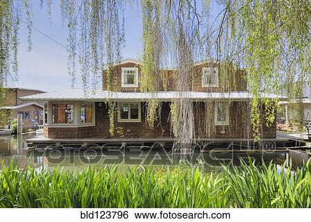 Houseboat on canal View Large Photo Image Stock Photograph - Houseboat on canal. Fotosearch
