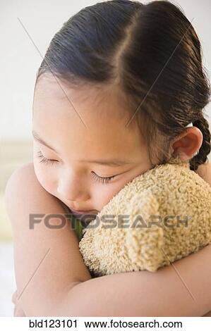 Korean girl hugging teddy bear View Large Photo Image Stock Image - Korean girl hugging teddy bear. Fotosearch