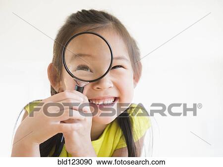 Korean girl using magnifying glass View Large Photo Image Stock Image - Korean girl using magnifying glass. Fotosearch