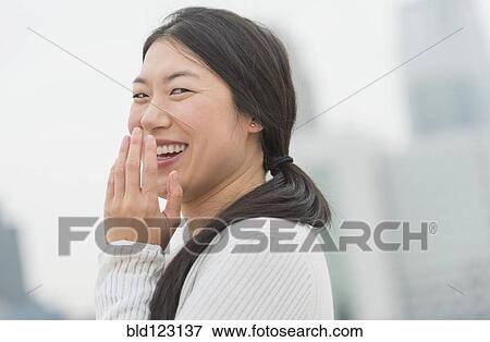 Korean woman laughing View Large Photo Image Stock Photo - Korean woman laughing. Fotosearch