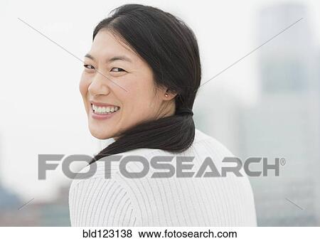 Korean woman smiling View Large Photo Image Stock Photo - Korean woman smiling. Fotosearch