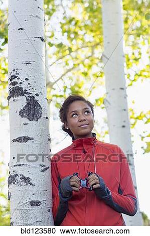 Mixed race girl using binoculars in woods View Large Photo Image Stock Image - Mixed race girl using binoculars in woods. Fotosearch
