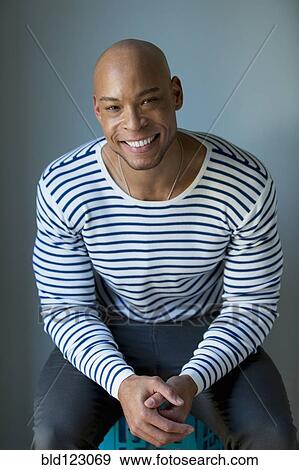 Mixed race man in striped shirt View Large Photo Image Stock Photo - Mixed race man in striped shirt. Fotosearch