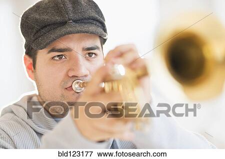 Mixed race man playing trumpet View Large Photo Image Stock Photo - Mixed race man playing trumpet. Fotosearch