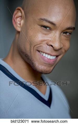 Stock Image - Mixed race man smiling. Fotosearch